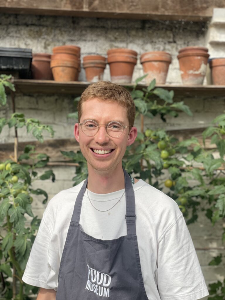 Young chef in greenhouse